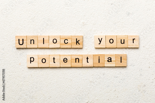 unlock your potential word written on wood block. unlock your potential text on table, concept
