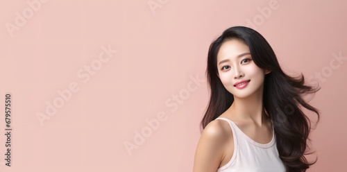 Asian modeler poses for beauty and cosmetics product advertising, copy space for text, soft and smooth white skin Chinese or Korean woman in a skincare commercial poster