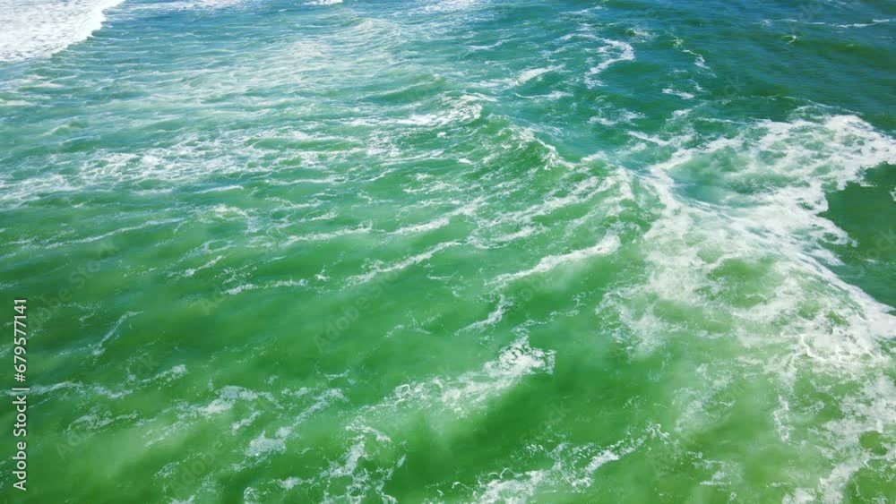Tumultuous ocean waves running onto shore at historic Cape L'Agulhas, aerial Tumultuous ocean waves running onto shore at historic Cape L'Agulhas, aerial
