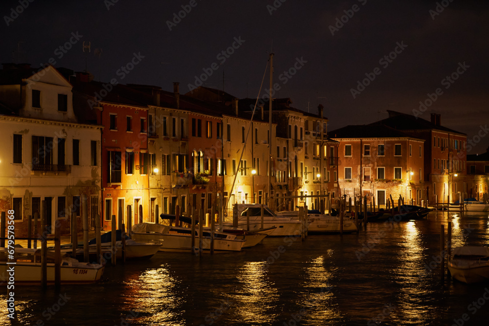 Fishermen's houses and boats in Venezia. Old Venetian houses at night. Venice - 4 May, 2019