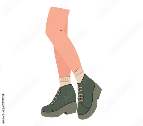 Beautiful female legs in stylish boots. Vector isolated flat fashion shoe illustration. © Ekaterina