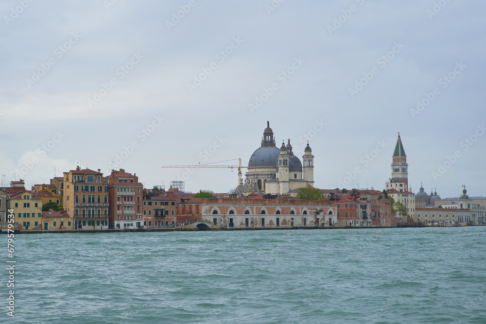 Waterfront of Guidecca canal in Venezia in stormy spring day. Venice - 4 May, 2019