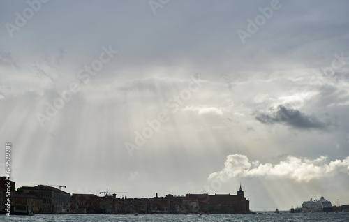 Rays of light above Venezia. Stormy weather in Venetian lagoon. Venice - 4 May, 2019