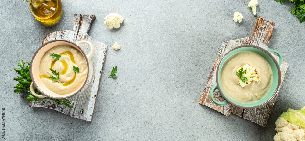 Vegetable soup with cauliflower on a light background. Long banner format. top view. copy space for text Vegetable soup with cauliflower on a light background. Long banner format. top view. copy space for text
