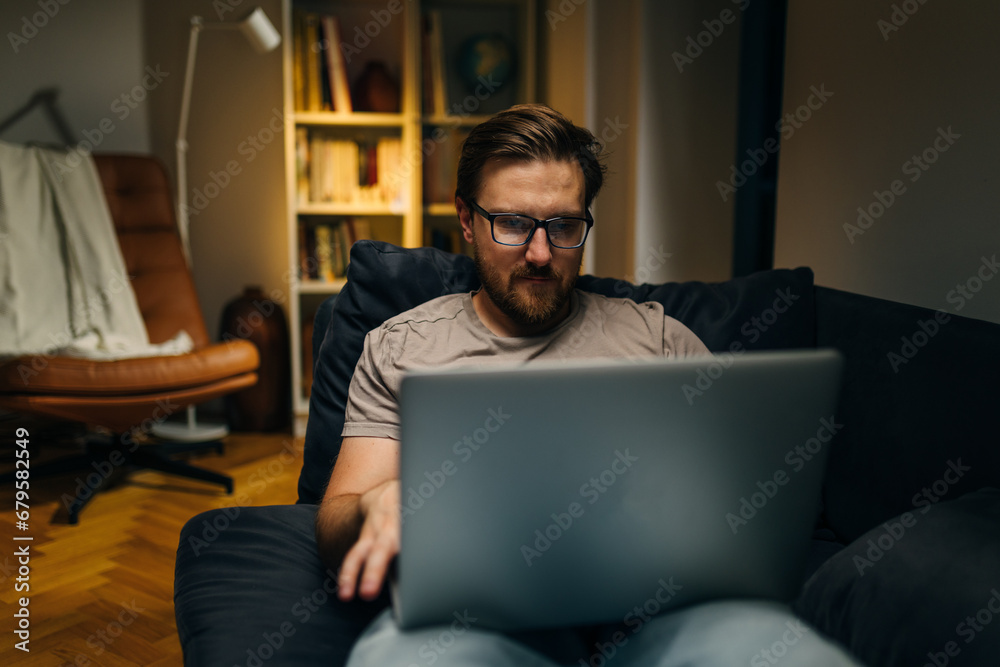 Freelancer working from home on the sofa. Freelancer working from home on the sofa.