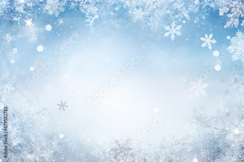 Winter snowy blurred defocused blue background with copy space. Flakes of snow fall. Festive Christmas and New year background