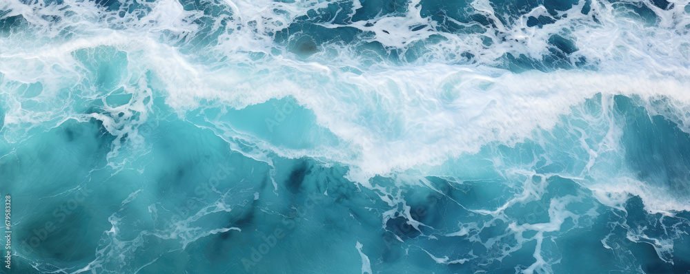 Sea waves or ocean surface from aerial view. Blue water with foam, copy space for text.