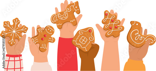 Children holding decorated gingerbreads. Kid's hands with traditional Christmas cookies