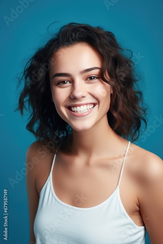 smiling woman enjoying beauty treatment on blue background. AI Generated