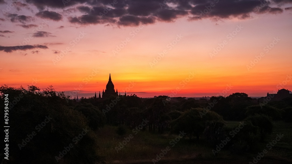 Sunset over the Bagan region in Myanmar with the view of temples.