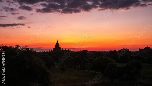Sunset over the Bagan region in Myanmar with the view of temples. © Wirestock
