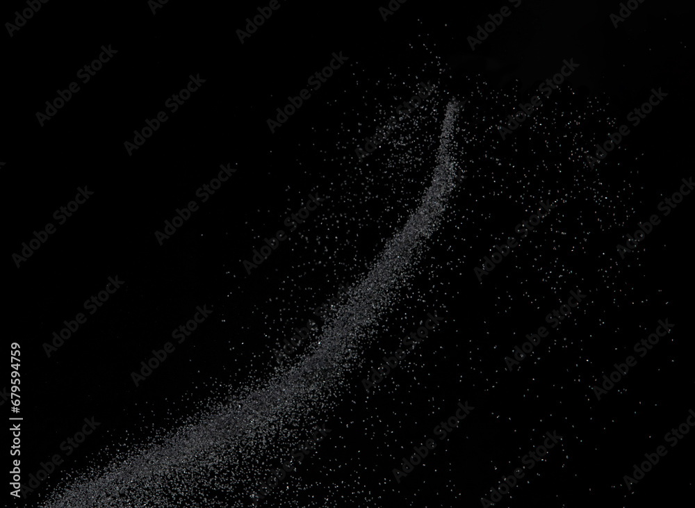 Million of black sand explosion, Photo image of falling down sands flying. Freeze shot on black background isolated overlay. Tiny Fine sand dust magnet as particle disintegrate science