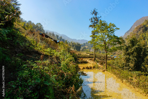 The village of Kat Kat in valley of the city Sapa. Valley with rice fields. Rice multi-stage gardens. Vietnam photo