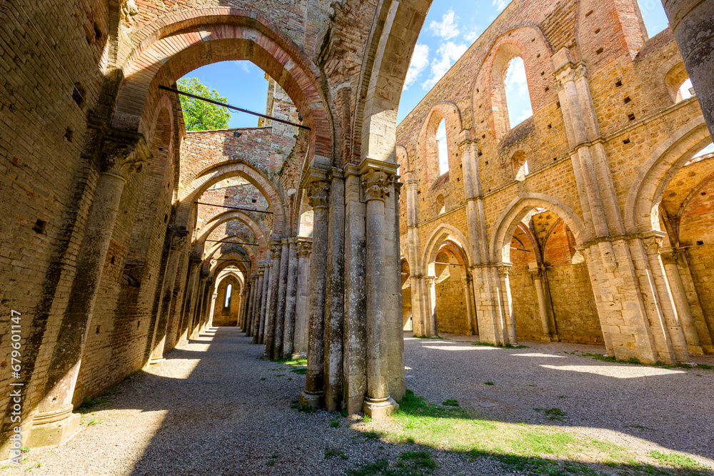 Main hall of abandoned San Galgano Abbey, a Cistercian monastery from the Middle Ages built in Chiusdino, a Tuscany countryside village in Central Italy