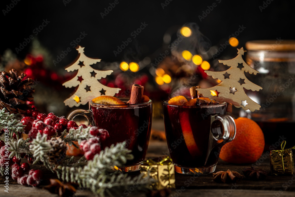 Hot red mulled wine in glass with orange, Traditional hot drink or beverage, festive cocktail
