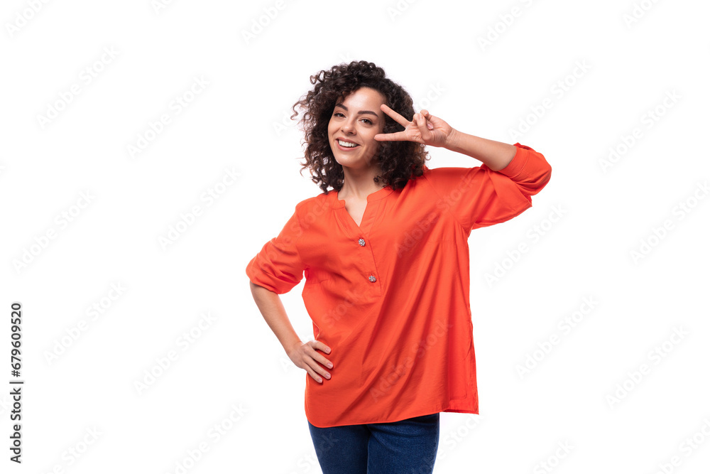 young cheerful caucasian lady with curly hair style dressed in orange shirt young cheerful caucasian lady with curly hair style dressed in orange shirt