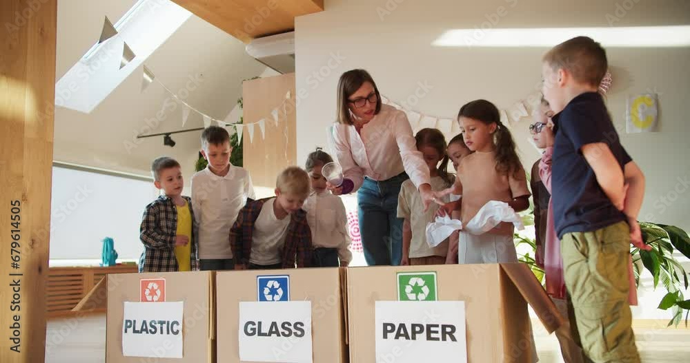 Sorting Garbage Child a teacher girl with a bob hairstyle in glasses in a white shirt teaches ...