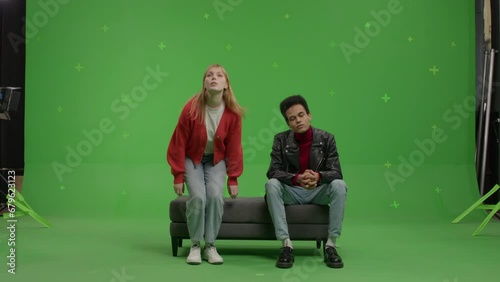 GREEN SCREEN Multi-racial couple pretending they are visiting a museum or art exhibition  (ID: 679623123)