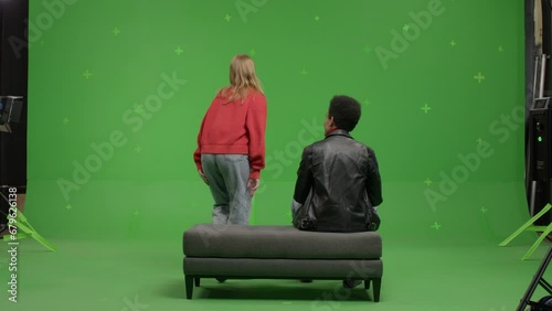 GREEN SCREEN Multi-racial couple pretending they are visiting a museum or art exhibition  (ID: 679626138)