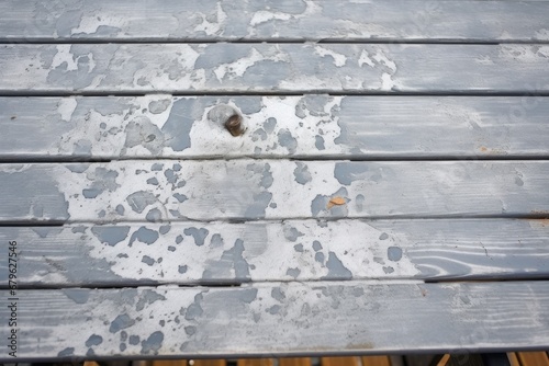 gray paint cracking on an outdoor table