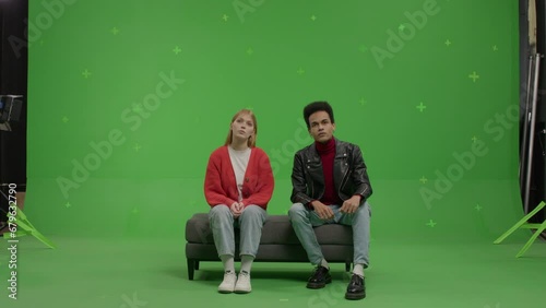 GREEN SCREEN Multi-racial couple pretending they are visiting a museum or art exhibition  (ID: 679632790)