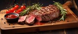 Delicious grilled sliced Beef Steak with sauce tomatoes and rosemary on a wood plate. AI generated image
