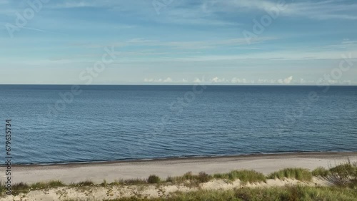 Ustka's seaside beach during autumn, showcasing a tranquil coastal scene.