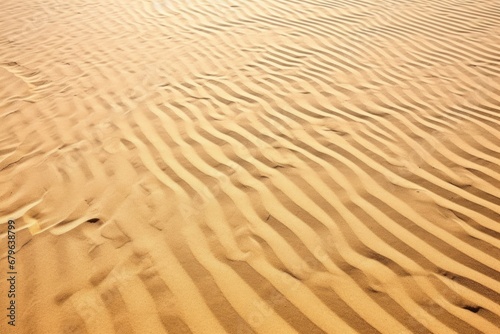 close-up of sunlit golden desert sand dunes