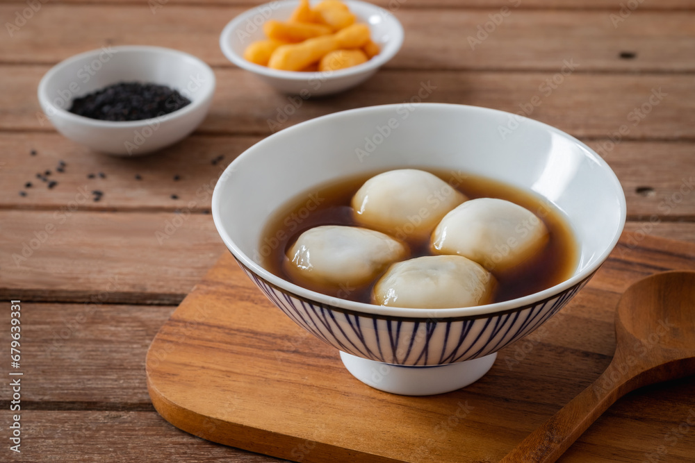 Glutinous rice balls filled with black sesame in sweet ginger soup Glutinous rice balls filled with black sesame in sweet ginger soup