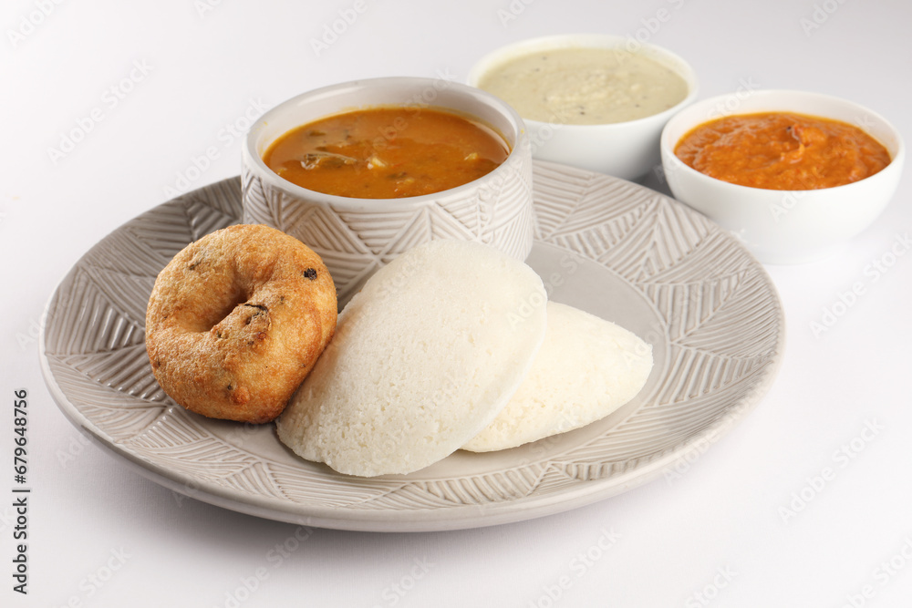 food South Indian food idli vada with sambar on a banana leaf