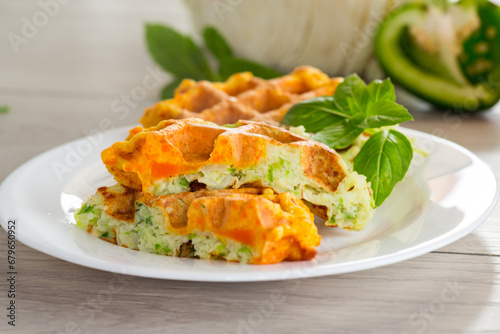 cooked two-color vegetable waffles made from cabbage and carrots.