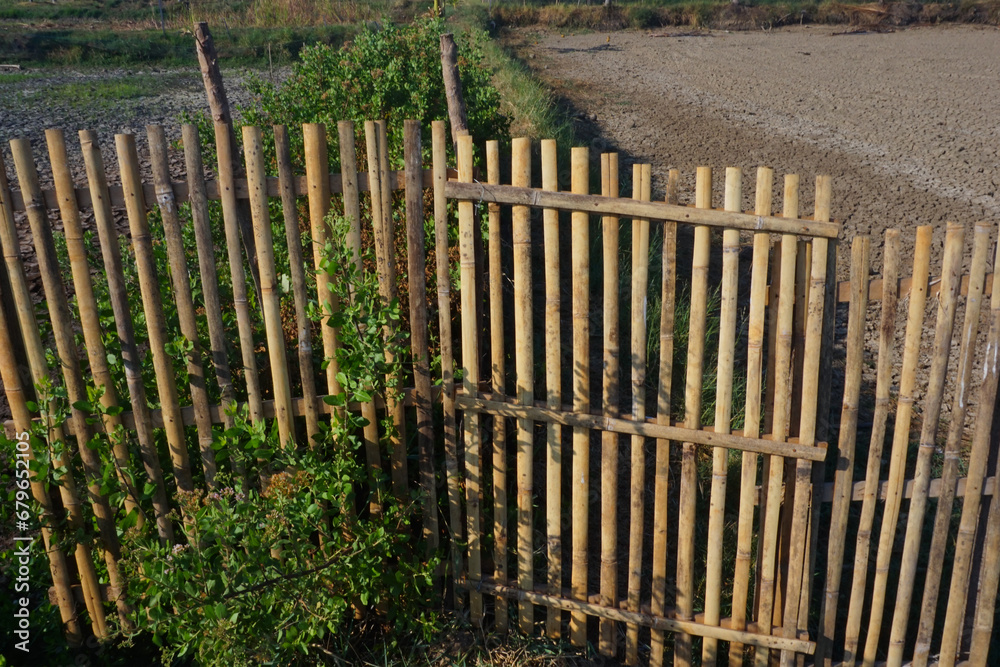Dry bamboo fencing adds a rustic feel Dry bamboo fencing adds a rustic feel