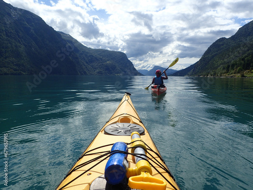 Sea kayaking in Norwegian fjord. Summer. photo