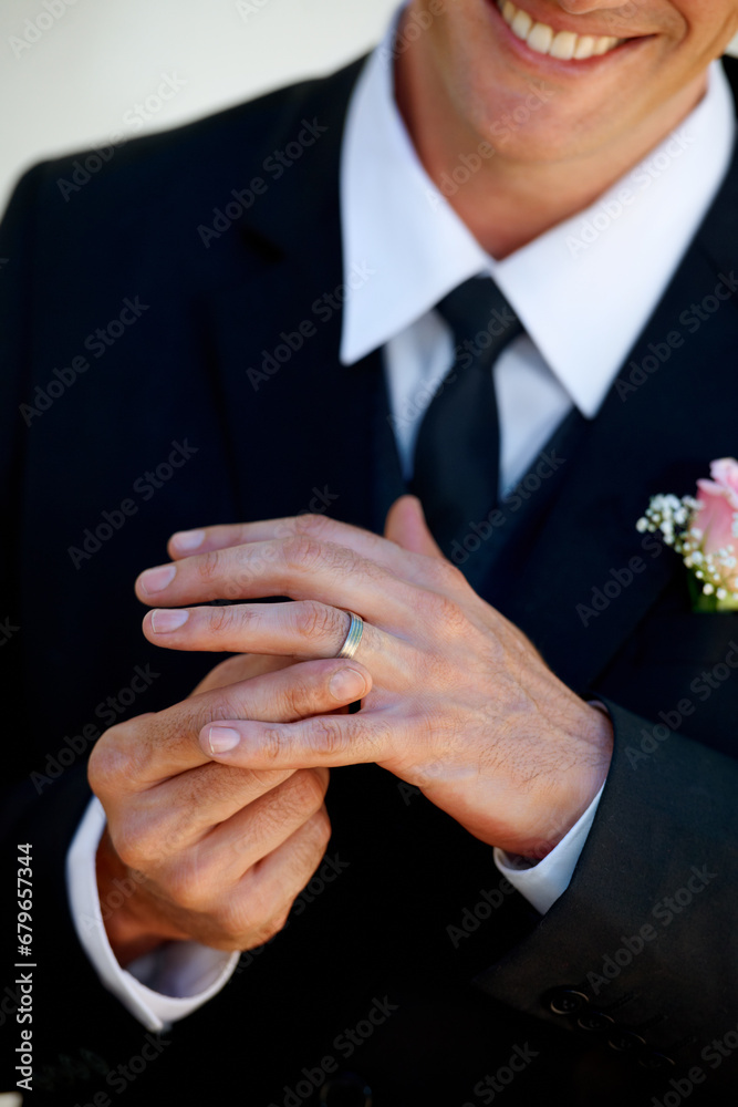 Obraz premium Hands, groom man and ring for wedding, celebration and commitment to relationship, smile and pride. Person, metal jewelry and tuxedo suit for marriage, happy and closeup at event, party or reception