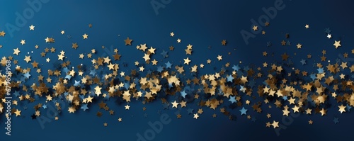 golden christmas glitter on blue background banner © krissikunterbunt