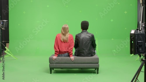 GREEN SCREEN Multi-racial couple pretending they are visiting a museum or art exhibition  (ID: 679660119)