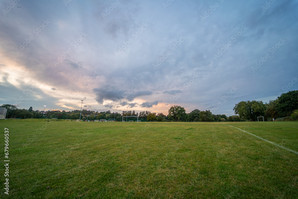 Large empty camping area in England during sunset Large empty camping area in England during sunset