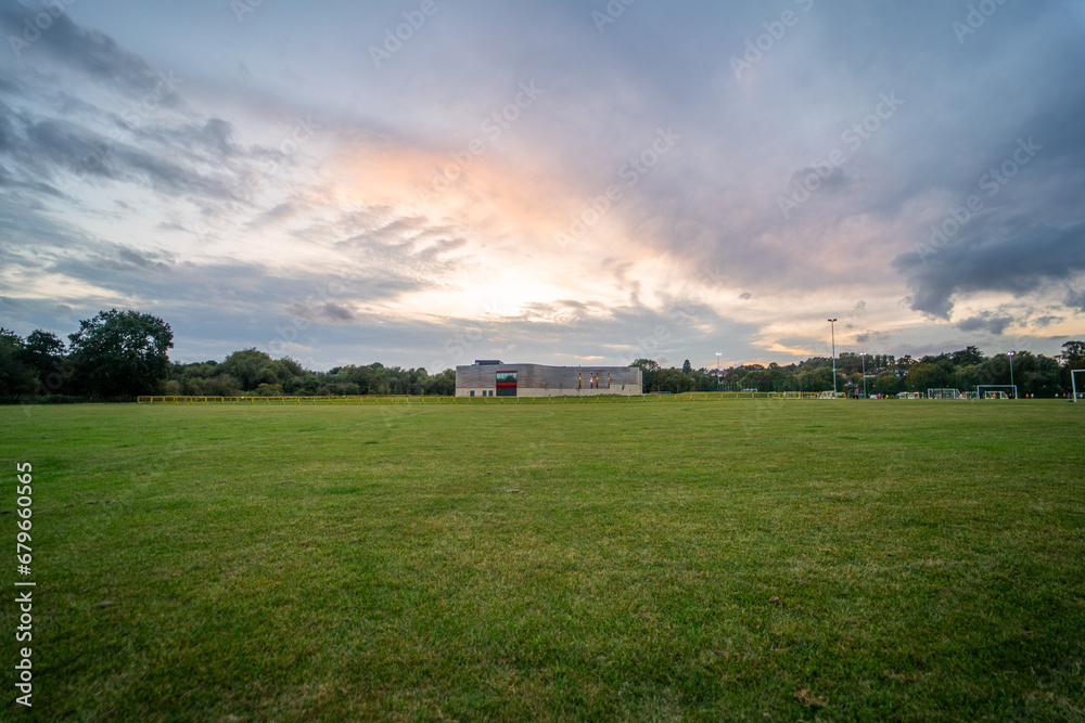 Large empty camping area in England during sunset - obrazy, fototapety, plakaty 