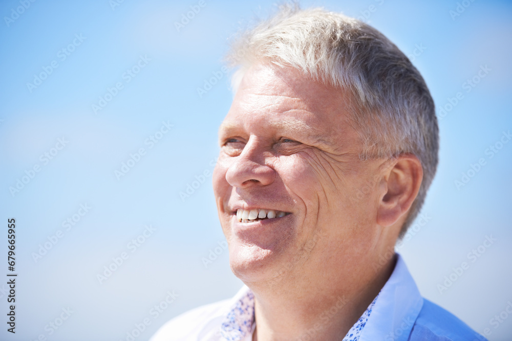 Face, thinking and happy senior man outdoor for travel, freedom or journey on blue sky background. Smile, relax and elderly male person outside with gratitude for fresh air, retirement or vacation Face, thinking and happy senior man outdoor for travel, freedom or journey on blue sky background. Smile, relax and elderly male person outside with gratitude for fresh air, retirement or vacation