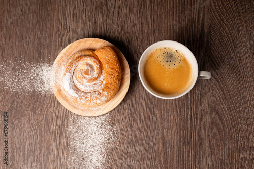 Breakfast with ensaimada and cup of coffee photo