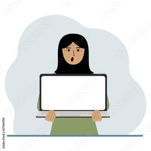 The woman is holding a laptop with the screen facing away from him. On the screen of the laptop there is a place for text. Laptop computer technology concept, online education, online work.