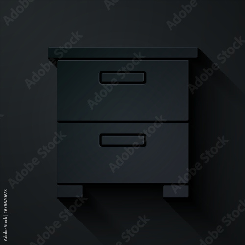 Paper cut Furniture nightstand icon isolated on black background. Paper art style. Vector