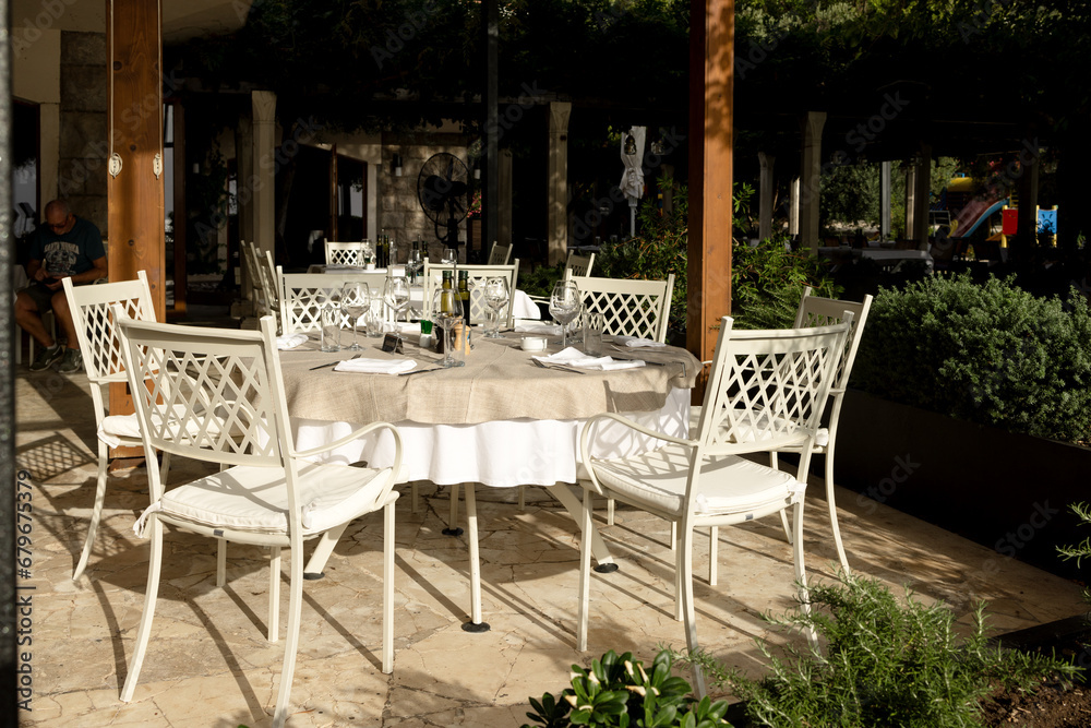 Fototapeta premium A set table on the summer veranda of the restaurant