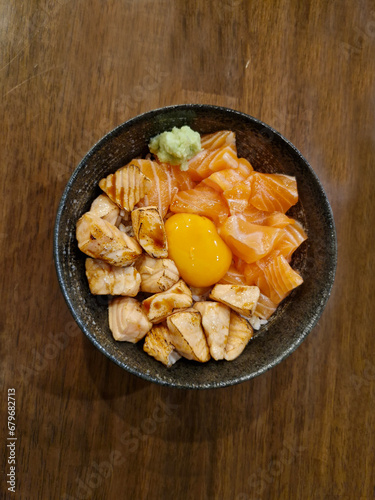 Salmon Donburi Japanese Food,  Grilled and Fresh Salmon Don with Pickled Egg Yolk in Soy Sauce.
