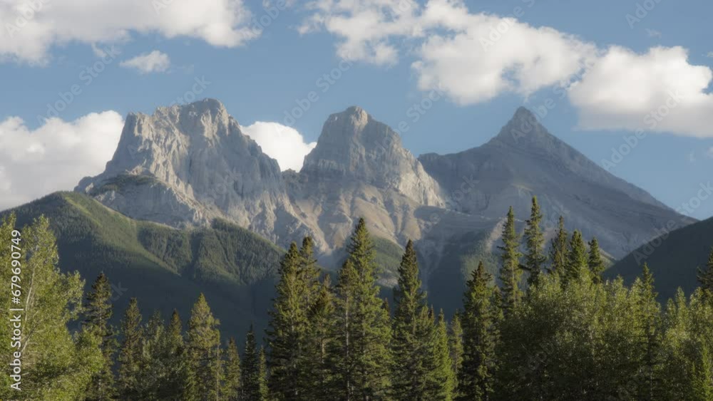 Clouds moving over Three Sisters mountain near Canmore, Alberta, Canada. Timelapse. Clouds moving over Three Sisters mountain near Canmore, Alberta, Canada. Timelapse.