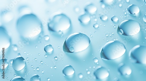  a close up of water droplets on a blue surface with a light blue back ground and a light blue back ground.