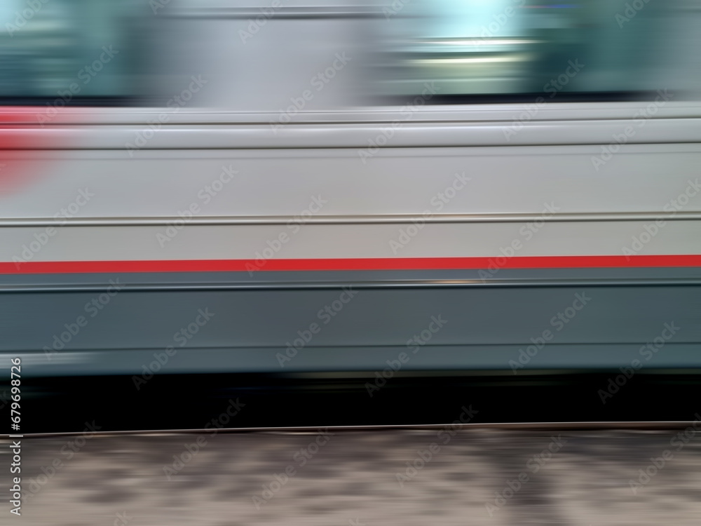 Close-up of a train moving on the street in motion blur Close-up of a train moving on the street in motion blur