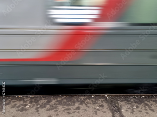 Close-up of a train moving on the street in motion blur