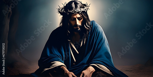 Jesus Christ wearing the crown of thorns in a misterious dark florest. photo