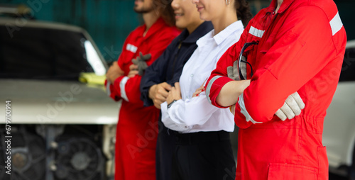Professional team working at workplace. Unity and teamwork concept. Portrait engineer and mechanic repair factory worker and mechanic team together in factory workplace. Diverse man and woman
